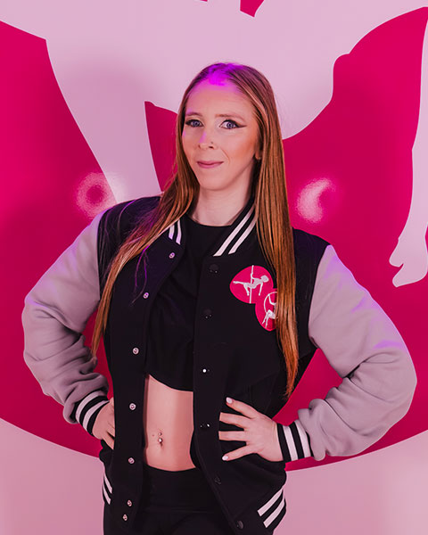 Pole & Aerial Divas team member in branded jacket